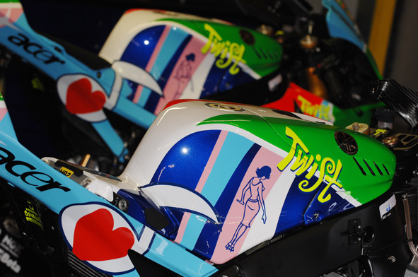 a group of motorcycle racing helmets on a bike