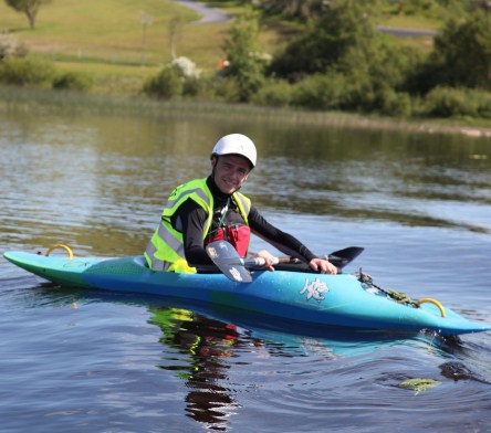 man in kayak, preparing to enter the river