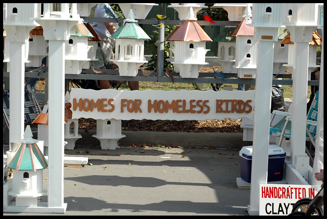 a sign advertising homes for homeless s