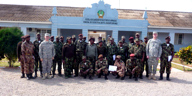 soldiers standing outside of an african war reserve building