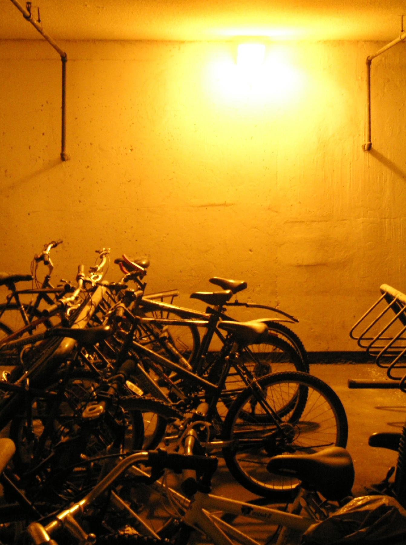 bicycles and bicycles are parked up in a parking garage