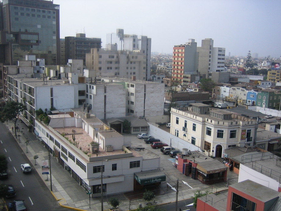 a city with high rise buildings and green roofs