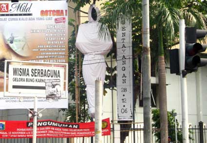 the statue of a man is decorated with various signs