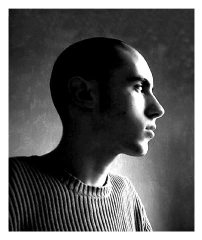 a black and white po of a man with shaved head