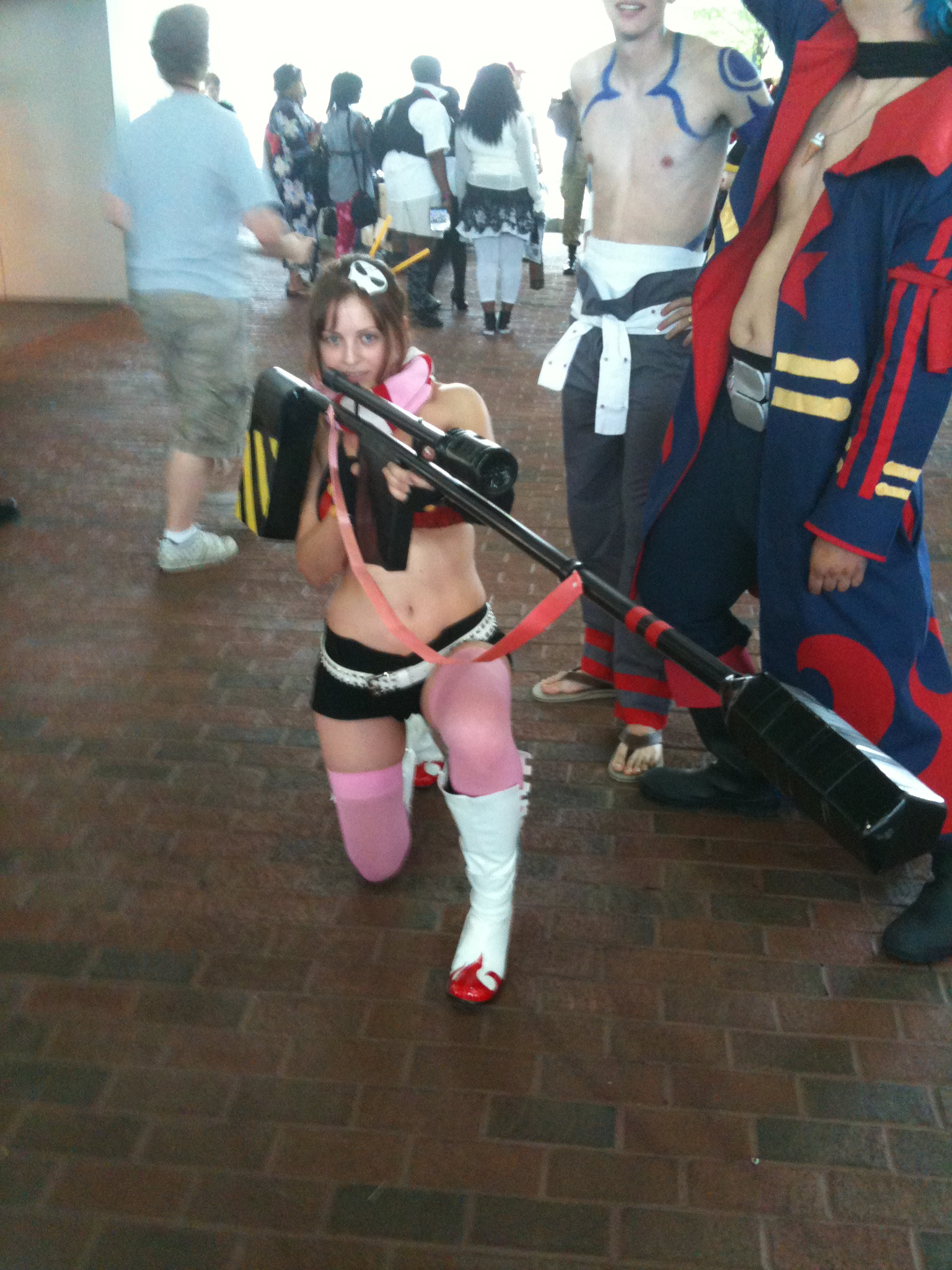 a woman with a long saber and wearing a costume