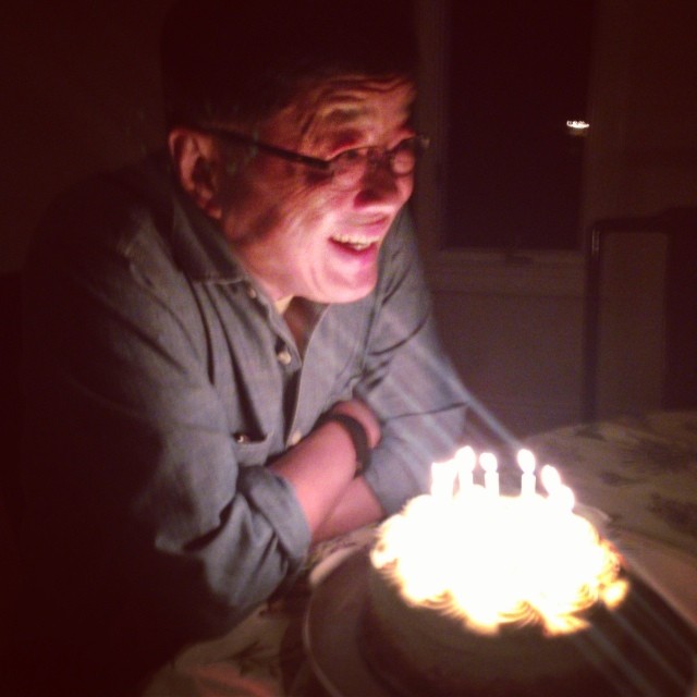 a man is blowing out his birthday candles