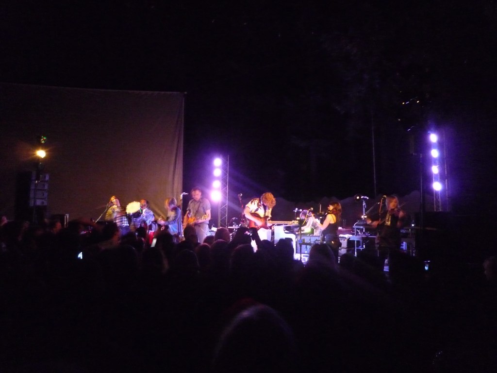 a group of people are performing on stage