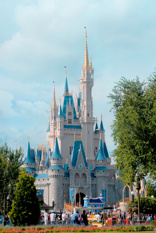 a large castle with many people walking around it