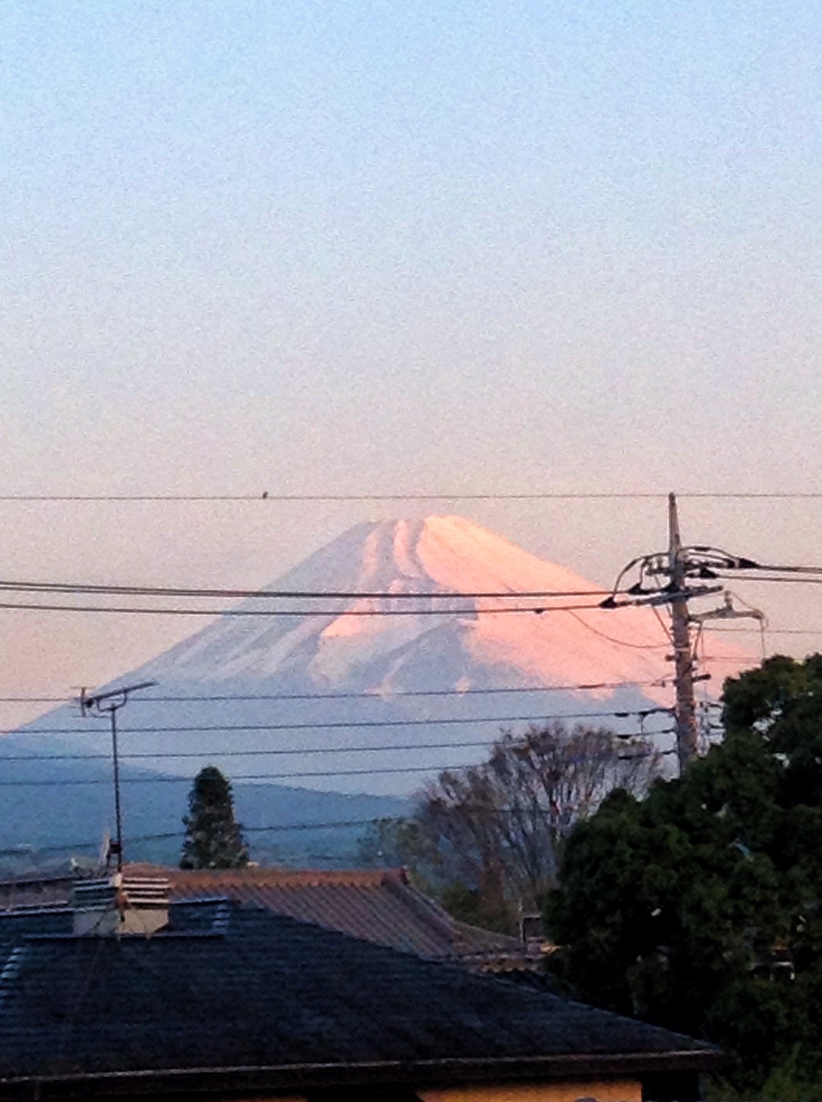 a mountain in the background near some power lines