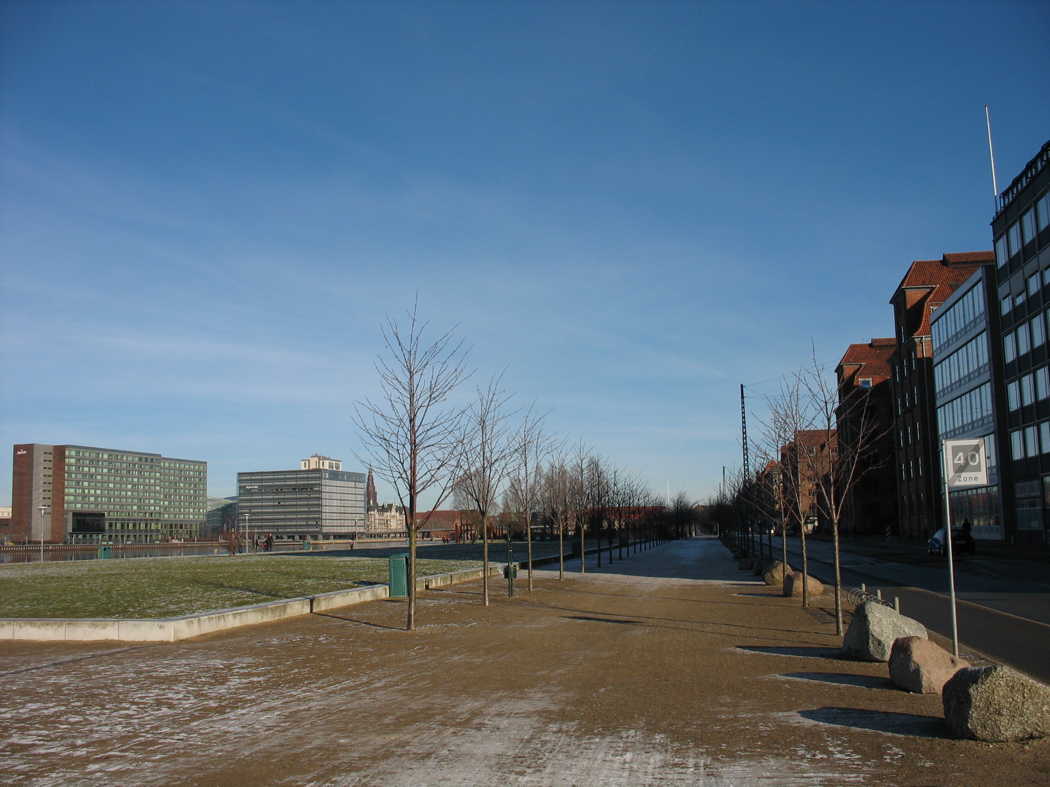 a view of an empty parking lot with buildings