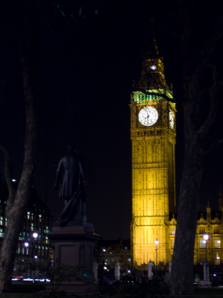 big ben tower lit up at night with lots of light on