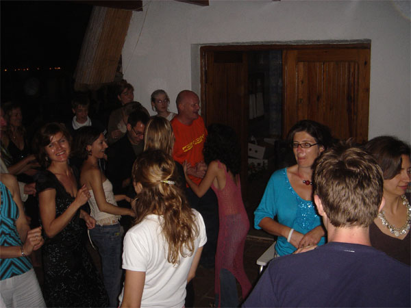 a group of people are dancing and having some fun