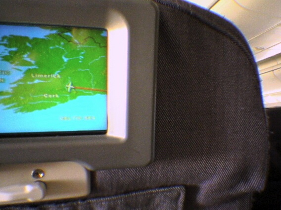 a small tv screen attached to the back of a seat