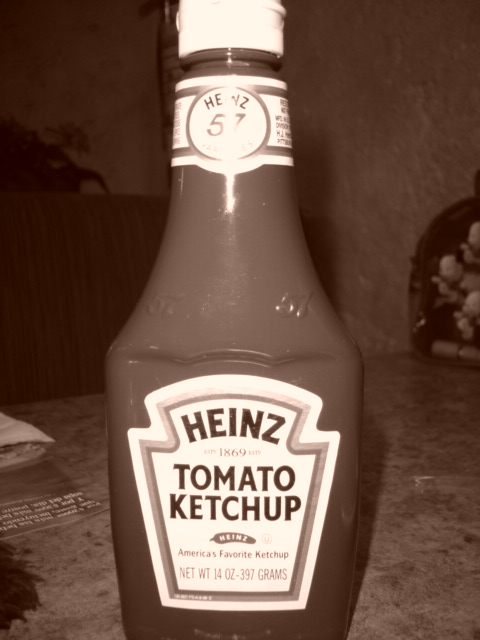 a bottle of heinz's tomato ketchup sitting on the counter