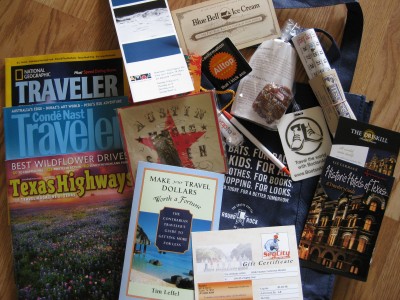 various travel brochures on a wooden surface