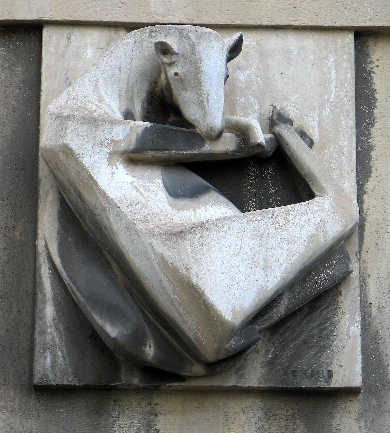 a small white sculpture with a cow sitting on it