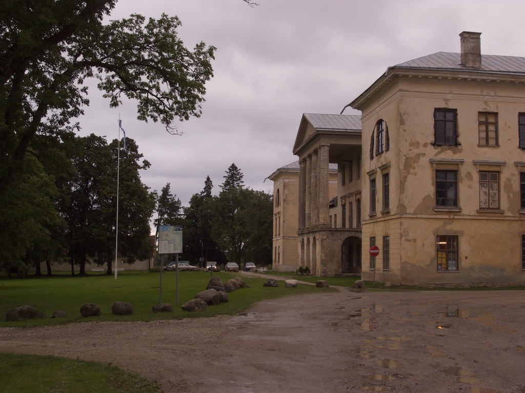 a large building with an outside graveled path