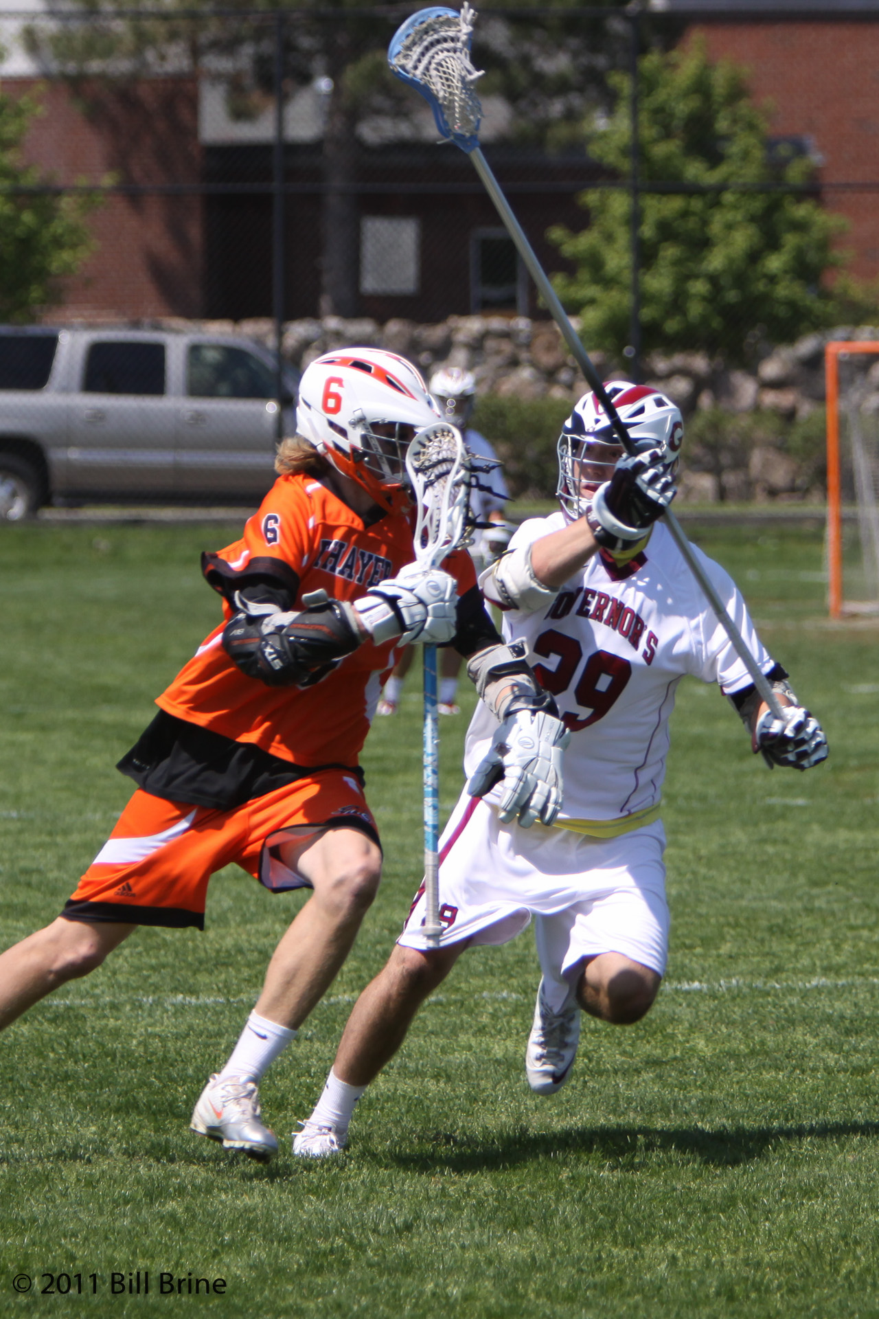 two players running for the ball during an outdoor game