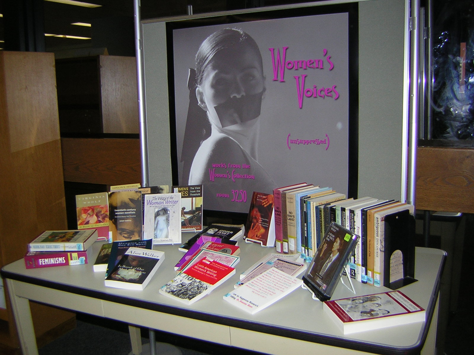 a table with several books and a sign