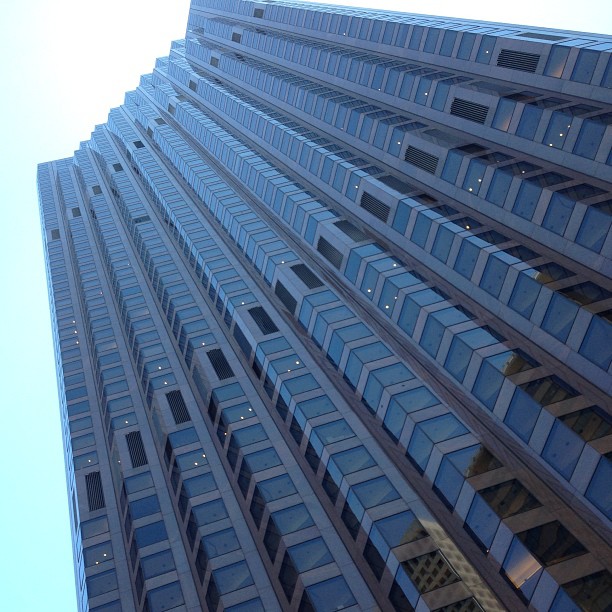 looking up at a very tall building from the ground