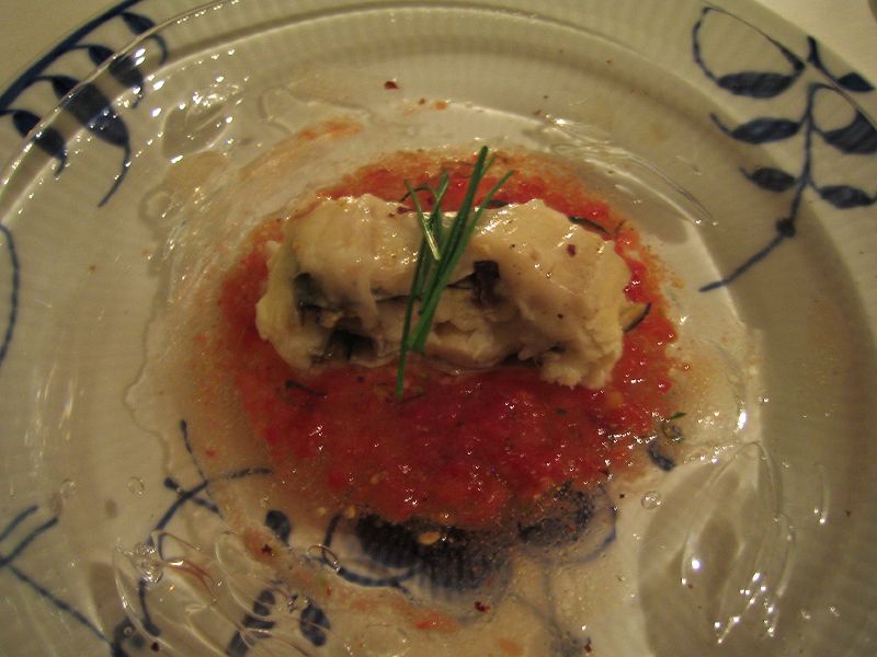 a plate with ravioli and sauce on it