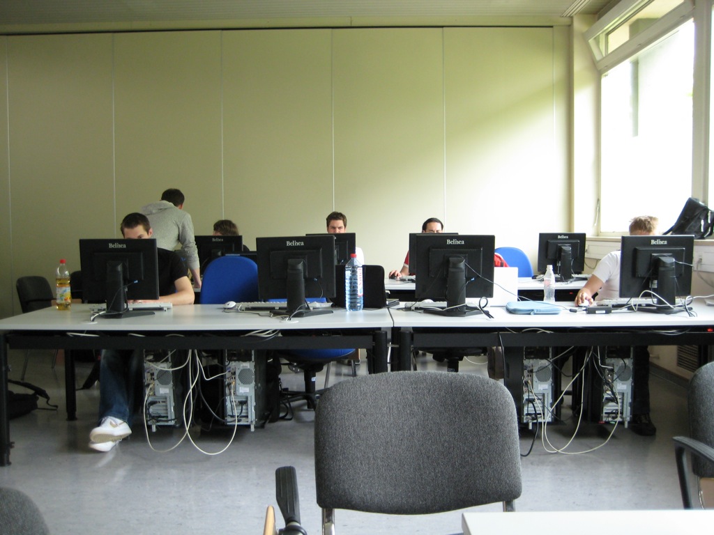 students at desks working on computer screens in a room