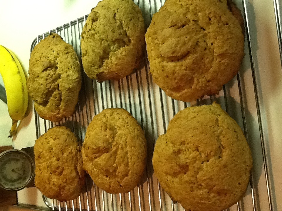 a few muffins and a banana on a table