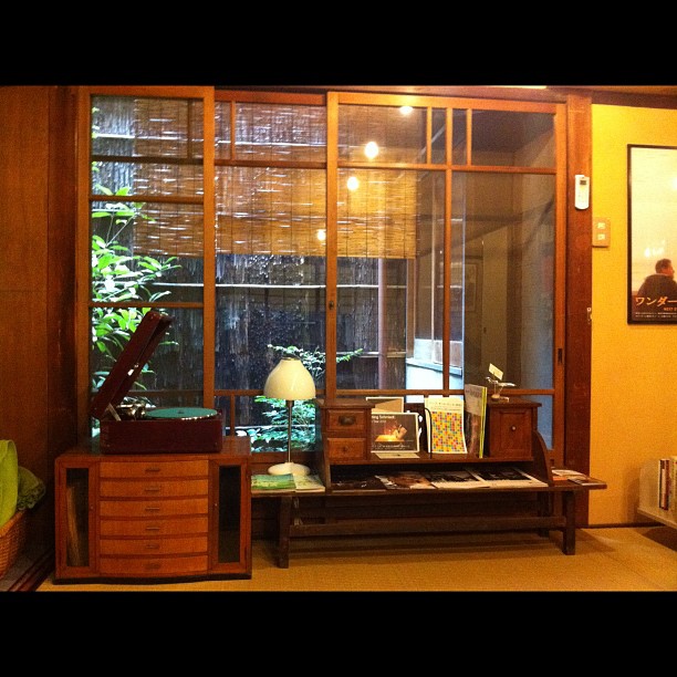an asian home office with two windows and furniture