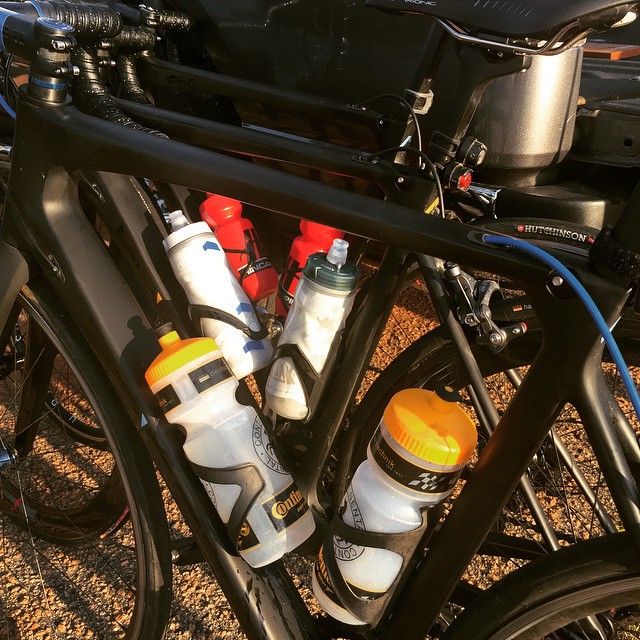 a close up of several different types of bottles attached to a bike