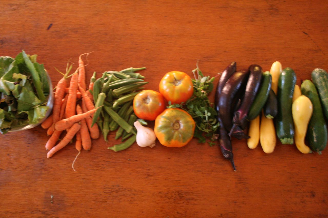 a group of veggies laying on a wooden table