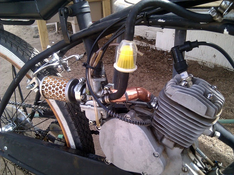 a close up of a motorcycle with other items in the back