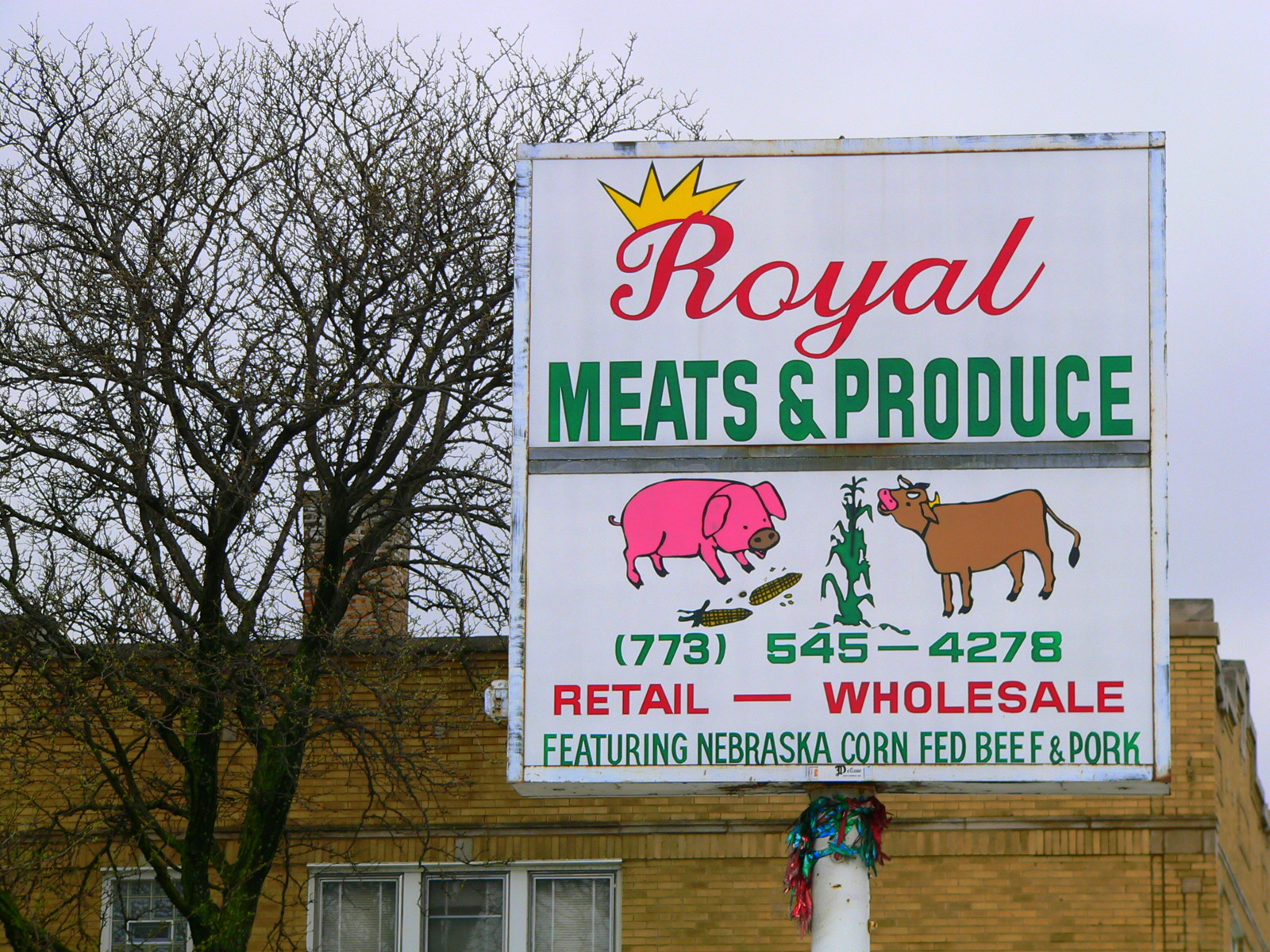 a restaurant sign on the side of the road