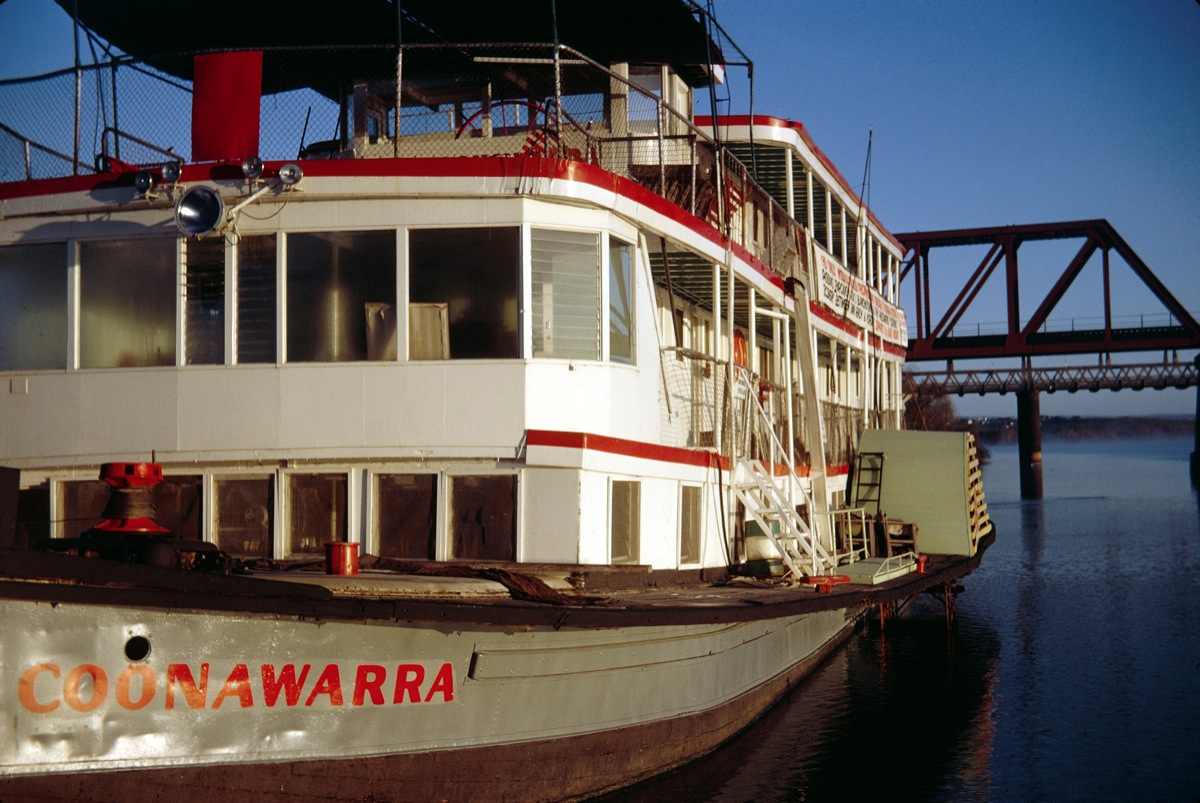 a large white boat with a red and white writing on it