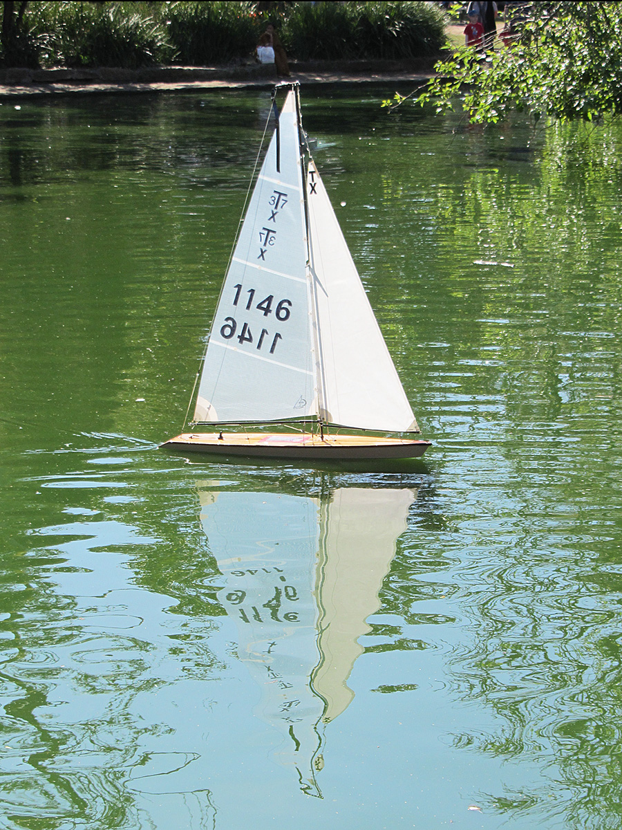a small sailboat floating on a lake