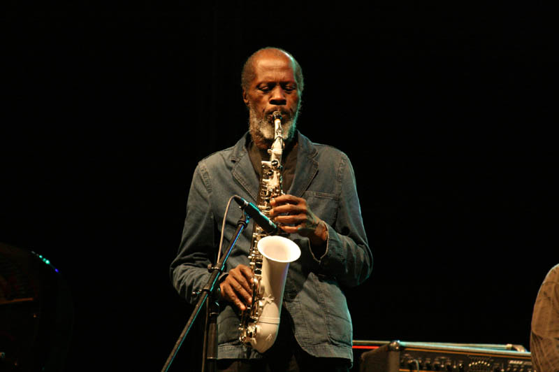 an image of a man playing an instrument on stage