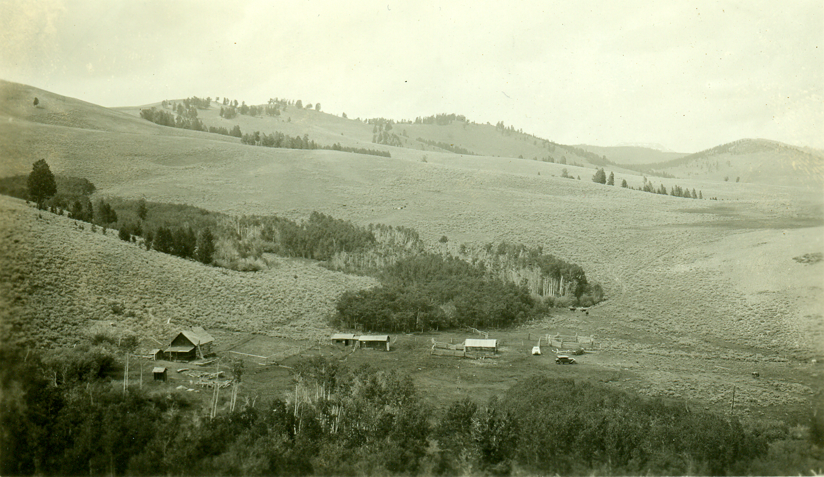 a picture of some small houses on a hill side