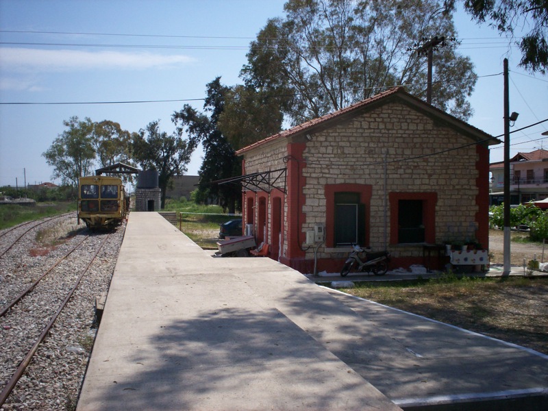 an old train station with the train entering