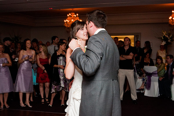 a couple having their first dance at a wedding reception