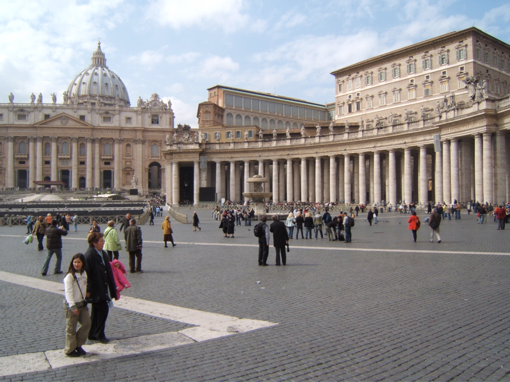 there are many people standing in the square together