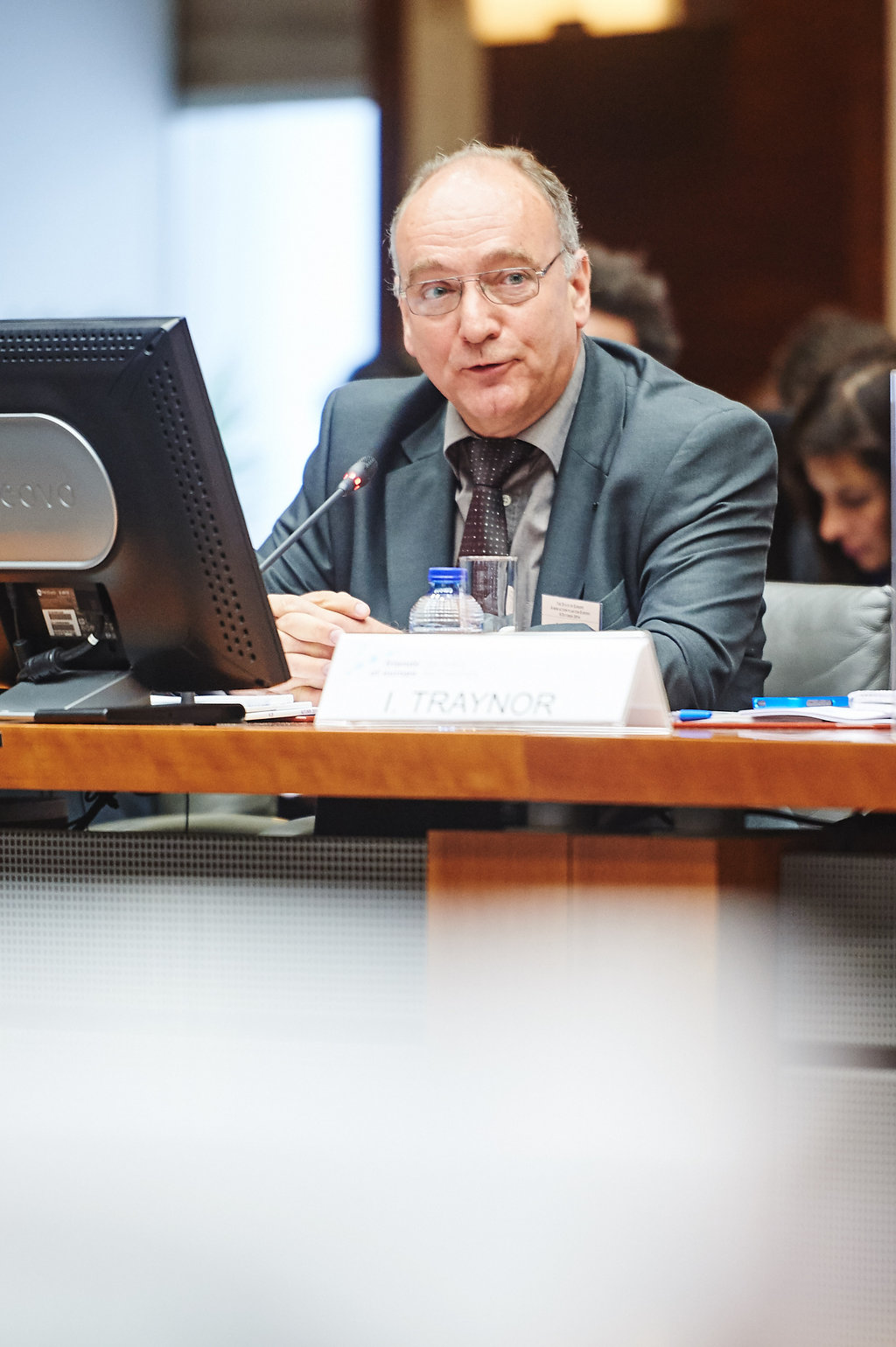 a man sits at a table with his computer