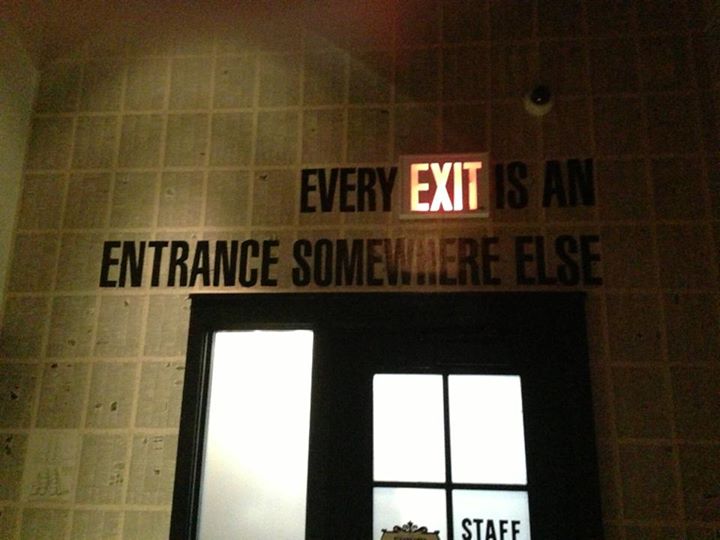 an exit sign is above the windows and below it