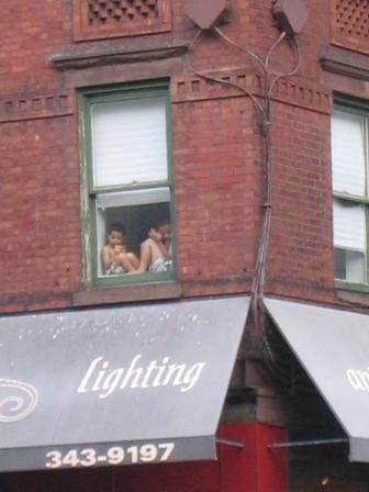 two people in the window of a restaurant
