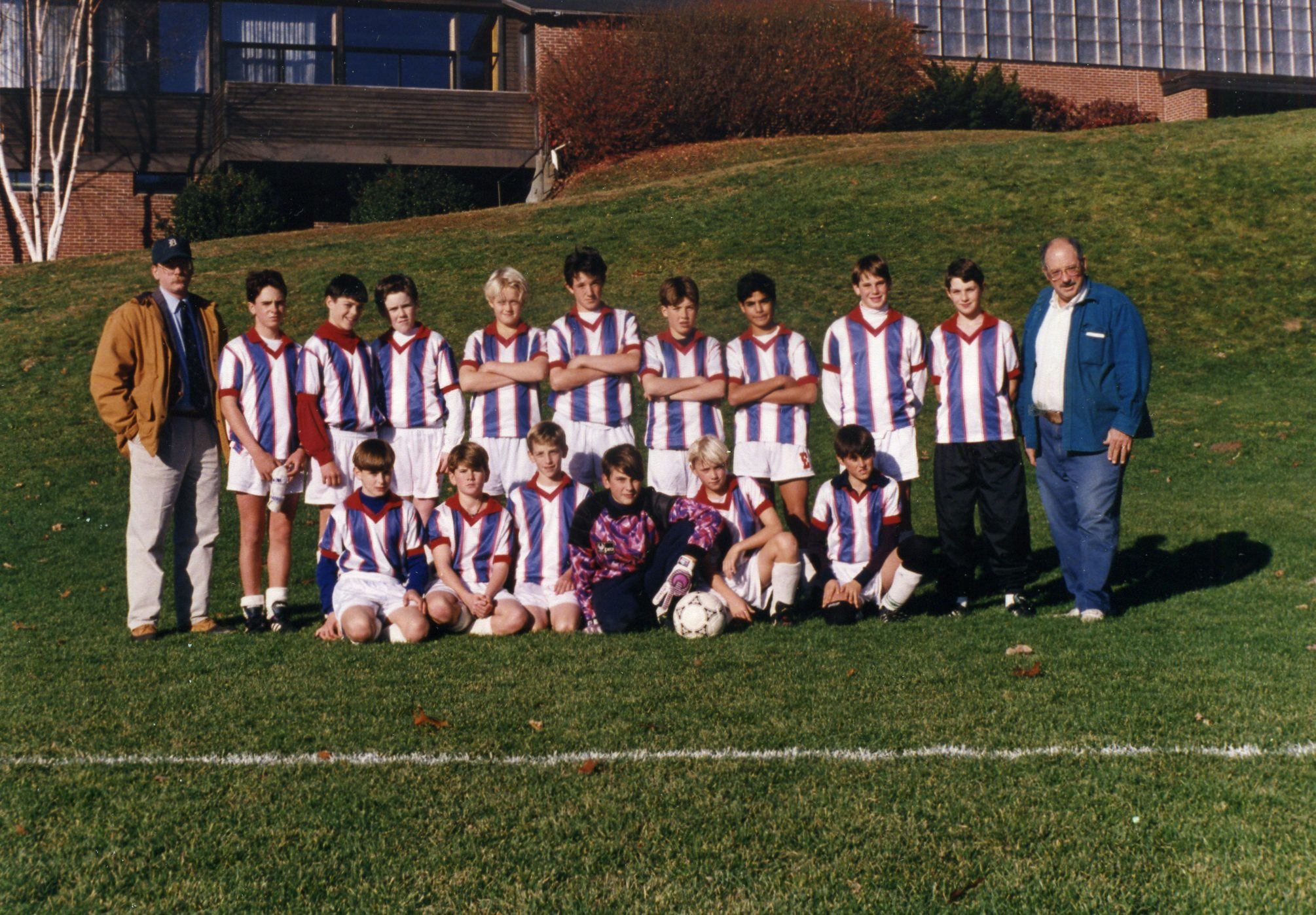 a bunch of young soccer players are posing for a picture