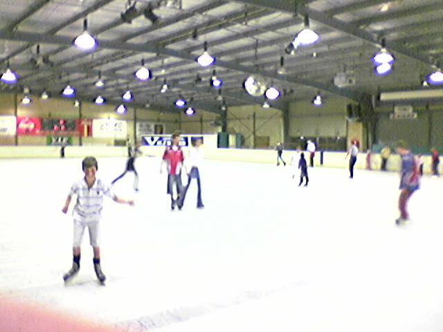 a  is on an ice rink skating on ice