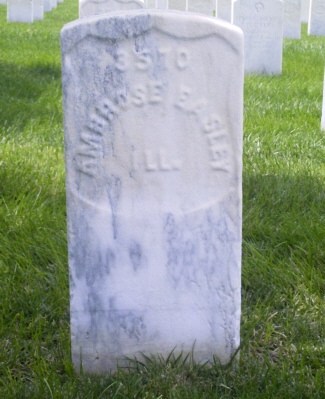 a headstone with the initials and date of a man