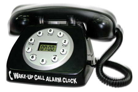 a black dial phone with white letters and the word wake - up call alarm clock
