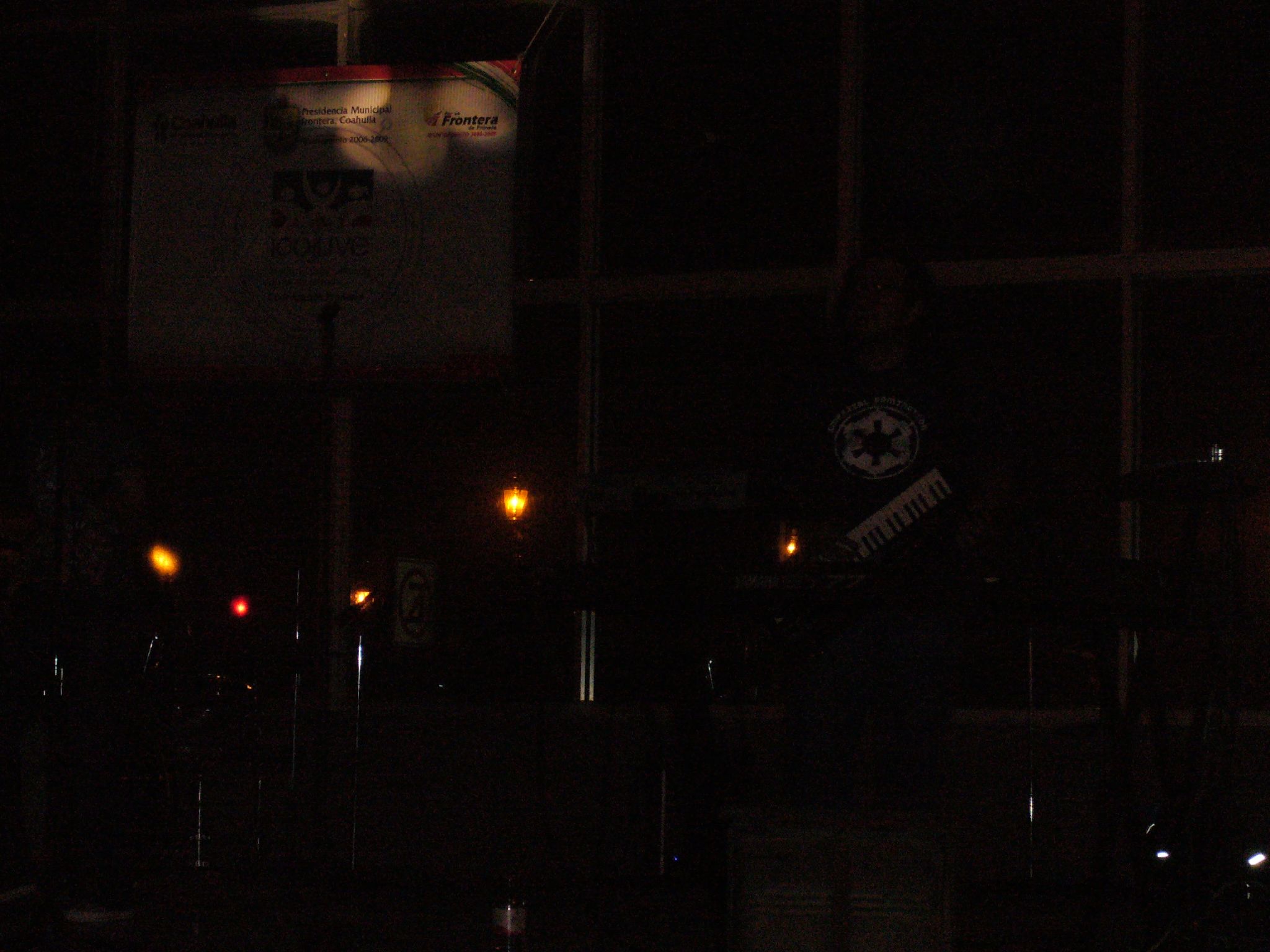 a man on a street corner holding a kite