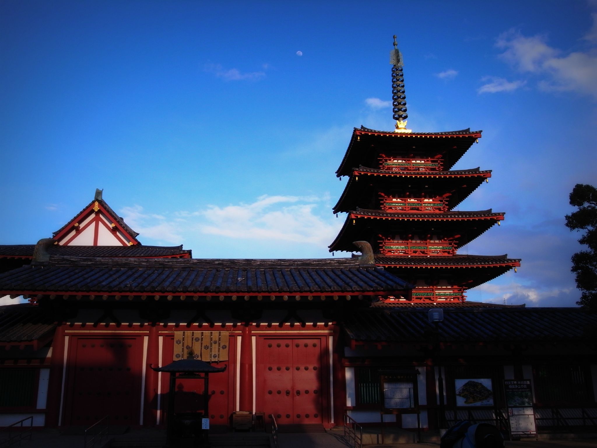 the large pagoda has an elaborate red roof