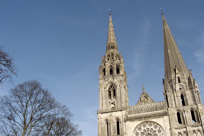 a gothic cathedral with two towers against a blue sky