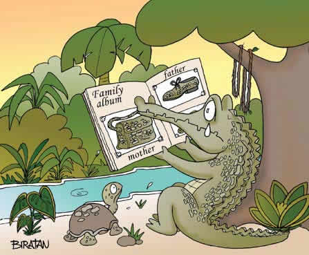 a dinosaur sitting on the ground with a book in its hand